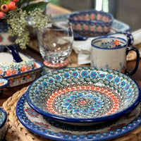 A picture of a Polish Pottery 9" Pasta Bowl (Teal Pompons) | NDA112-62 as shown at PolishPotteryOutlet.com/products/9-pasta-bowl-teal-pompons-nda112-62