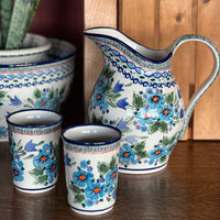 A picture of a Polish Pottery Zaklady 1.7 Liter Fancy Pitcher (Swirling Flowers) | Y1160-A1197A as shown at PolishPotteryOutlet.com/products/1-7-liter-fancy-pitcher-swirling-flowers-y1160-a1197a