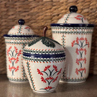 A picture of a Polish Pottery Zaklady 8" Strawberry Canister (Climbing Aster) | Y1873-A1145A as shown at PolishPotteryOutlet.com/products/8-strawberry-canister-climbing-aster-y1873-a1145a