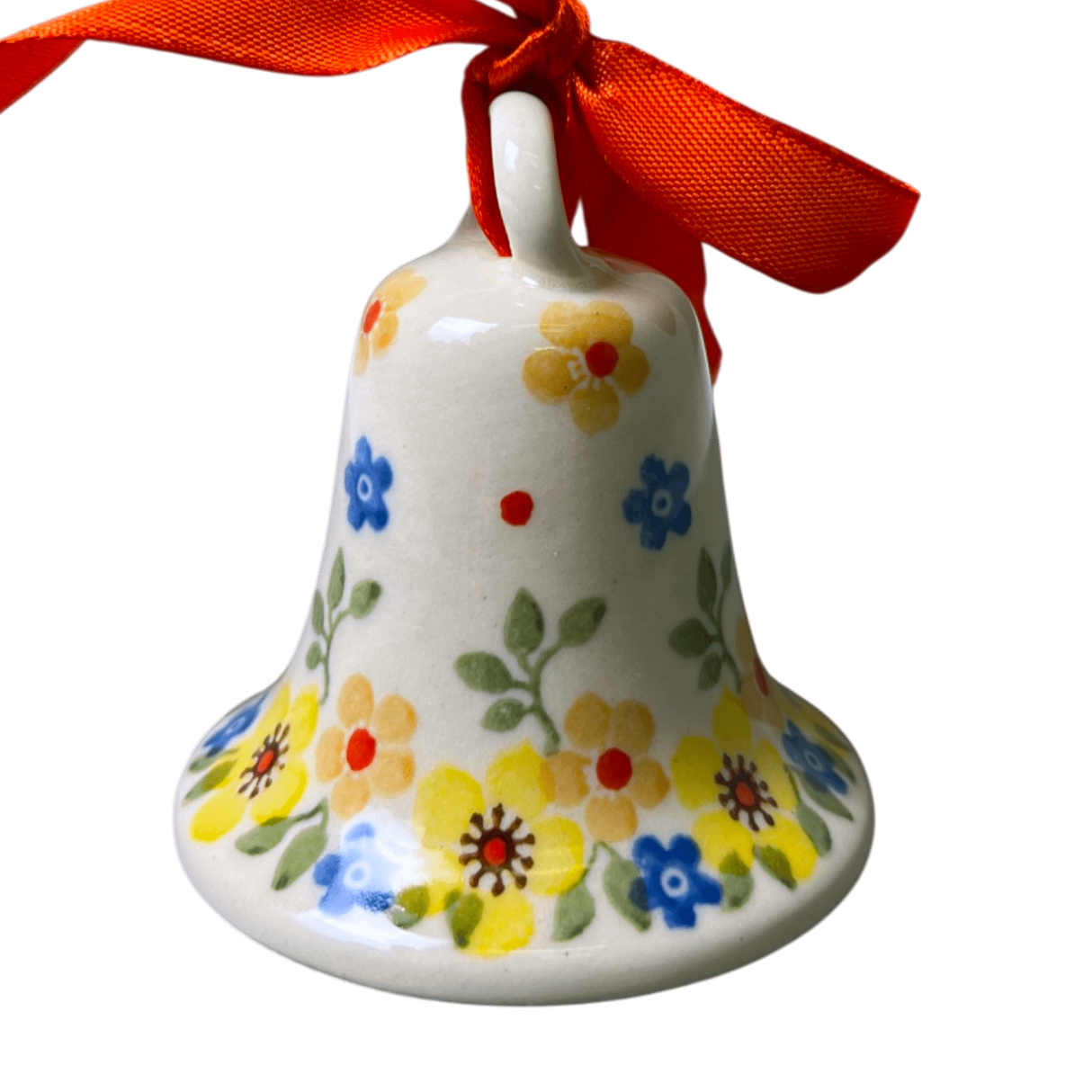 A small ceramic bell ornament with a white body decorated with colorful hand-painted flowers in yellow, blue, and red, tied at the top with a bright red ribbon bow, isolated on a white background.