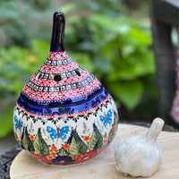 A picture of a Polish Pottery Zaklady 8.5" Large Garlic Keeper (Floral Swallows) | Y1835-DU182 as shown at PolishPotteryOutlet.com/products/8-5-large-garlic-keeper-floral-swallows-y1835-du182