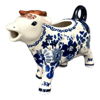 A picture of a Polish Pottery Cow Creamer (Blue Life) | D081S-EO39 as shown at PolishPotteryOutlet.com/products/cow-creamer-blue-life-d081s-eo39