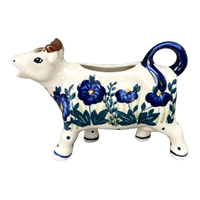 A picture of a Polish Pottery Cow Creamer (Bouncing Blue Blossoms) | D081U-IM03 as shown at PolishPotteryOutlet.com/products/cow-creamer-bouncing-blue-blossoms-d081u-im03