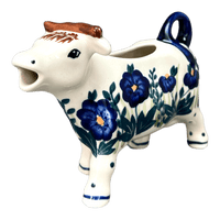 A picture of a Polish Pottery Cow Creamer (Bouncing Blue Blossoms) | D081U-IM03 as shown at PolishPotteryOutlet.com/products/cow-creamer-bouncing-blue-blossoms-d081u-im03