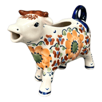 A picture of a Polish Pottery Cow Creamer (Autumn Harvest) | D081S-LB as shown at PolishPotteryOutlet.com/products/cow-creamer-autumn-harvest-d081s-lb