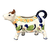 A picture of a Polish Pottery Cow Creamer (Ducks in a Row) | D081U-P323 as shown at PolishPotteryOutlet.com/products/cow-creamer-ducks-in-a-row-d081u-p323