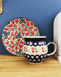 A picture of a Polish Pottery Large Belly Mug (Peacock In Line) | K068T-54A as shown at PolishPotteryOutlet.com/products/large-belly-mug-peacock-in-line