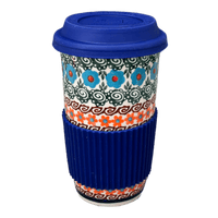 A picture of a Polish Pottery 14 oz. Travel Mug (Teal Pompons) | NDA281-62 as shown at PolishPotteryOutlet.com/products/14-oz-travel-mug-teal-pompons-nda281-62