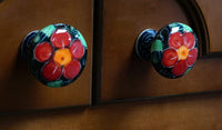 A picture of a Polish Pottery Drawer Pulls (Pansy Storm) | WR67A-EZ3 as shown at PolishPotteryOutlet.com/products/drawer-pulls-pansy-storm-wr67a-ez3