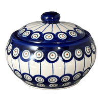 A picture of a Polish Pottery WR Round Covered Container (Peacock in Line) | WR31I-SM1 as shown at PolishPotteryOutlet.com/products/round-covered-container-peacock-in-line-wr31i-sm1