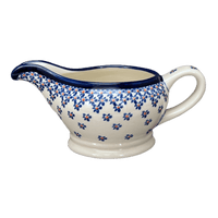 A picture of a Polish Pottery Zaklady 16 oz. Gravy Boat (Falling Blue Daisies) | Y1258-A882A as shown at PolishPotteryOutlet.com/products/45-liter-gravy-boat-falling-blue-daisies-y1258-a882a