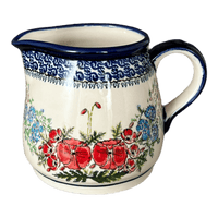 A picture of a Polish Pottery Zaklady 1.2 Liter Pitcher (Floral Crescent) | Y463-ART237 as shown at PolishPotteryOutlet.com/products/1-2-liter-pitcher-fields-of-flowers-y463-art237