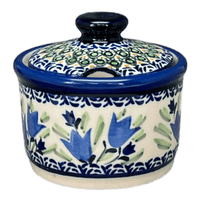 A picture of a Polish Pottery Zaklady 4" Sugar Bowl (Blue Tulips) | Y698-ART160 as shown at PolishPotteryOutlet.com/products/4-sugar-bowl-blue-tulips-y698-art160