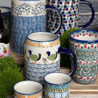 A picture of a Polish Pottery Small Tankard (Lily of the Valley) | K054T-ASD as shown at PolishPotteryOutlet.com/products/22-oz-bavarian-tankard-lily-of-the-valley-k054t-asd