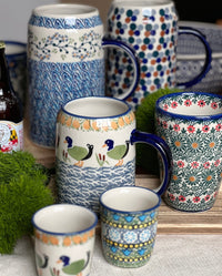 A picture of a Polish Pottery Large Tankard (Peacock in Line) | K053T-54A as shown at PolishPotteryOutlet.com/products/1-25-liter-bavarian-tankard-peacock-in-line-k053t-54a