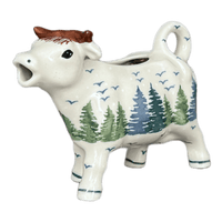 A picture of a Polish Pottery Cow Creamer (Pine Forest) | D081S-PS29 as shown at PolishPotteryOutlet.com/products/cow-creamer-pine-forest-d081s-ps29