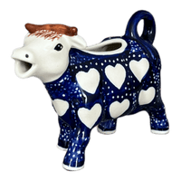 A picture of a Polish Pottery Cow Creamer (Sea of Hearts) | D081T-SEA as shown at PolishPotteryOutlet.com/products/cow-creamer-sea-of-hearts-d081t-sea