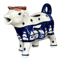 A picture of a Polish Pottery Cow Creamer (Winter's Eve) | D081S-IBZ as shown at PolishPotteryOutlet.com/products/cow-creamer-winters-eve-d081s-ibz