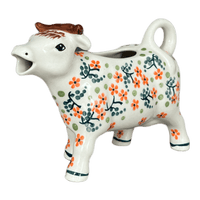 A picture of a Polish Pottery Cow Creamer (Peach Blossoms) | D081S-AS46 as shown at PolishPotteryOutlet.com/products/cow-creamer-peach-blossoms-d081s-as46