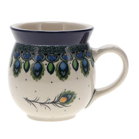 A picture of a Polish Pottery CA 16 oz. Belly Mug (Peacock Plume) | A073-2218X as shown at PolishPotteryOutlet.com/products/large-belly-mug-peacock-plume