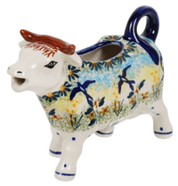 A picture of a Polish Pottery Cow Creamer (Soaring Swallows) | D081S-WK57 as shown at PolishPotteryOutlet.com/products/cow-creamer-soaring-swallows