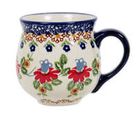 A picture of a Polish Pottery Medium Belly Mug (Mediterranean Blossoms) | K090S-P274 as shown at PolishPotteryOutlet.com/products/the-medium-belly-mug-mediterranean-blossoms
