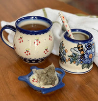 A picture of a Polish Pottery Teapot Saucer (Peacock Vine) | GPH08-UPL as shown at PolishPotteryOutlet.com/products/teapot-saucer-upl