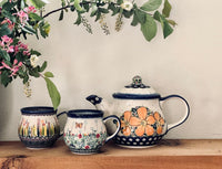 A picture of a Polish Pottery 1 Liter Teapot (Butterfly Fields) | GCZ01-GAM as shown at PolishPotteryOutlet.com/products/1-liter-teapot-butterfly-fields-gcz01-am
