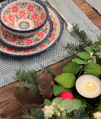 A picture of a Polish Pottery 10" Dinner Plate (Pink Poinsettia) | T132S-PS14 as shown at PolishPotteryOutlet.com/products/10-round-dinner-plate-pink-poinsettia-t132s-ps14