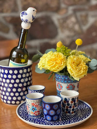 A picture of a Polish Pottery Bird-Shaped Wine Cork (Flower Power) | K118T-JS14 as shown at PolishPotteryOutlet.com/products/bird-shaped-wine-cork-flower-power-k118t-js14