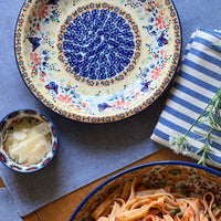 A picture of a Polish Pottery 9.25" Pasta Bowl (Scandinavian Scarlet) | T159U-P295 as shown at PolishPotteryOutlet.com/products/9-25-pasta-plate-scandinavian-scarlet-t159u-p295
