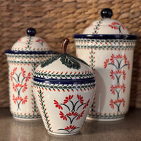 A picture of a Polish Pottery Zaklady Strawberry Canister (Blue Floral Vines) | Y1873-D1210A as shown at PolishPotteryOutlet.com/products/berry-keeper-blue-floral-vines-y1873-d1210a