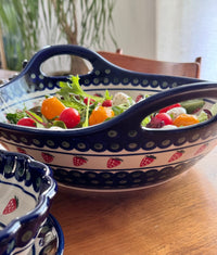 A picture of a Polish Pottery Zaklady 13.25" Bowl w/ Handles (Strawberry Dot) | Y1347A-A310A as shown at PolishPotteryOutlet.com/products/bowl-w-handles-strawberry-peacock-y1347a-a310a