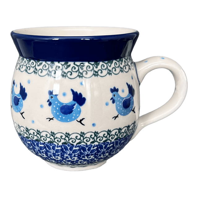 Decorative mug with blue rooster design on a white background