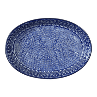 A picture of a Polish Pottery CA 13.75" x 9.25" Oval Baker (Wavy Blues) | A296-905X as shown at PolishPotteryOutlet.com/products/13-75-x-9-25-oval-baker-wavy-blues-a296-905x