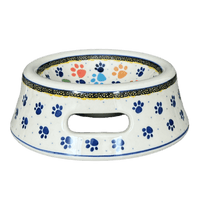 A picture of a Polish Pottery 5.5" Large Dog Bowl (Paw Parade) | 
A525-1769X as shown at PolishPotteryOutlet.com/products/5-5-large-dog-bowl-paw-parade-a525-1769x