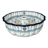 A picture of a Polish Pottery CA Bundt Cake Pan (Lone Owl) | AA55-U4872 as shown at PolishPotteryOutlet.com/products/bundt-cake-pan-lone-owl-aa55-u4872