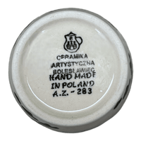A picture of a Polish Pottery CA 14 oz. Tumbler (Cowabunga - Blue Rim) | AC53-2417X as shown at PolishPotteryOutlet.com/products/14-oz-tumbler-cowabunga-blue-rim-ac53-2417x