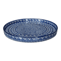 A picture of a Polish Pottery Round Tray (Wavy Blues) | AE93-905X as shown at PolishPotteryOutlet.com/products/round-tray-wavy-blues-ae93-905x