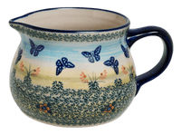 A picture of a Polish Pottery 1 Liter Pitcher (Butterflies in Flight) | D044S-WKM as shown at PolishPotteryOutlet.com/products/1-liter-wide-mouth-pitcher-butterflies-in-flight-d044s-wkm