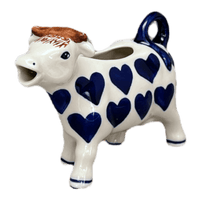 A picture of a Polish Pottery Cow Creamer (Whole Hearted) | D081T-SEDU as shown at PolishPotteryOutlet.com/products/4-oz-cow-creamer-whole-hearted-d081t-sedu