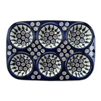 A picture of a Polish Pottery Muffin Pan (Peacock) | F093T-54 as shown at PolishPotteryOutlet.com/products/muffin-pan-peacock-f093t-54