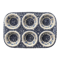 A picture of a Polish Pottery Muffin Pan (Lily of the Valley) | F093T-ASD as shown at PolishPotteryOutlet.com/products/muffin-pan-lily-of-the-valley-f093t-asd