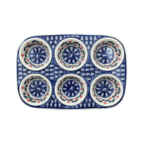 A picture of a Polish Pottery Muffin Pan (Holiday Cheer) | F093T-NOS2 as shown at PolishPotteryOutlet.com/products/muffin-pan-holiday-cheer-f093t-nos2