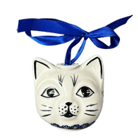 A picture of a Polish Pottery Cat Head Ornament (Snowy Pines) | K142T-U22 as shown at PolishPotteryOutlet.com/products/cat-head-ornament-snowy-pines-k142t-u22