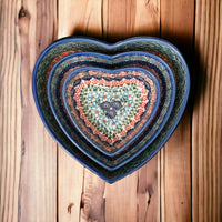 A picture of a Polish Pottery 5" x 5.25" Heart-Shaped Bowl (Zany Zinnia) | NDA366-35 as shown at PolishPotteryOutlet.com/products/5-x-5-25-heart-shaped-bowl-zany-zinnia-nda366-35