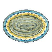 A picture of a Polish Pottery Large Scalloped Oval Platter (Butterflies in Flight) | P165S-WKM as shown at PolishPotteryOutlet.com/products/large-scalloped-oval-plater-butterflies-in-flight-p165s-wkm