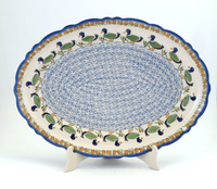 A picture of a Polish Pottery Large Scalloped Oval Platter (Ducks in a Row) | P165U-P323 as shown at PolishPotteryOutlet.com/products/16-75-x-12-25-large-scalloped-oval-platter-ducks-in-a-row-p165u-p323