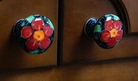 A picture of a Polish Pottery Drawer Pulls (Pansy Wreath) | WR67A-EZ2 as shown at PolishPotteryOutlet.com/products/drawer-pulls-pansy-wreath-wr67a-ez2