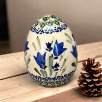 A picture of a Polish Pottery 4.5 " Painted Egg (Swirling Flowers) | Y1807O2-A1197A as shown at PolishPotteryOutlet.com/products/4-5-painted-egg-swirling-flowers-y1807o2-a1197a